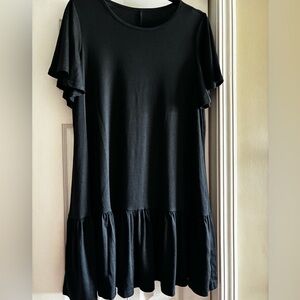 Black easy T-shirt style dress with ruffle bottom